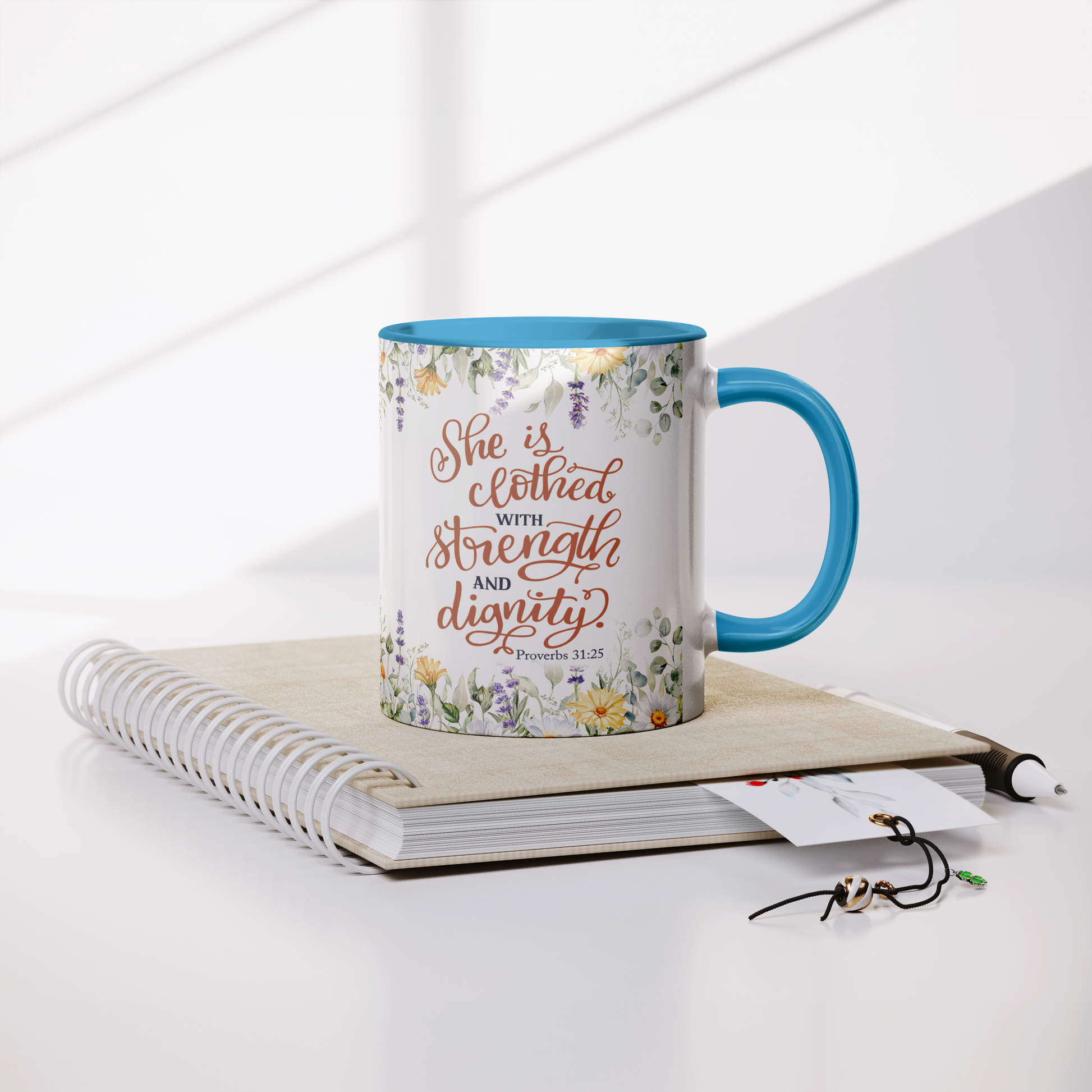 She_is_Clothed_in_Strength_and_Dignity_-_Lifestyle_Notebook_Mockup.png