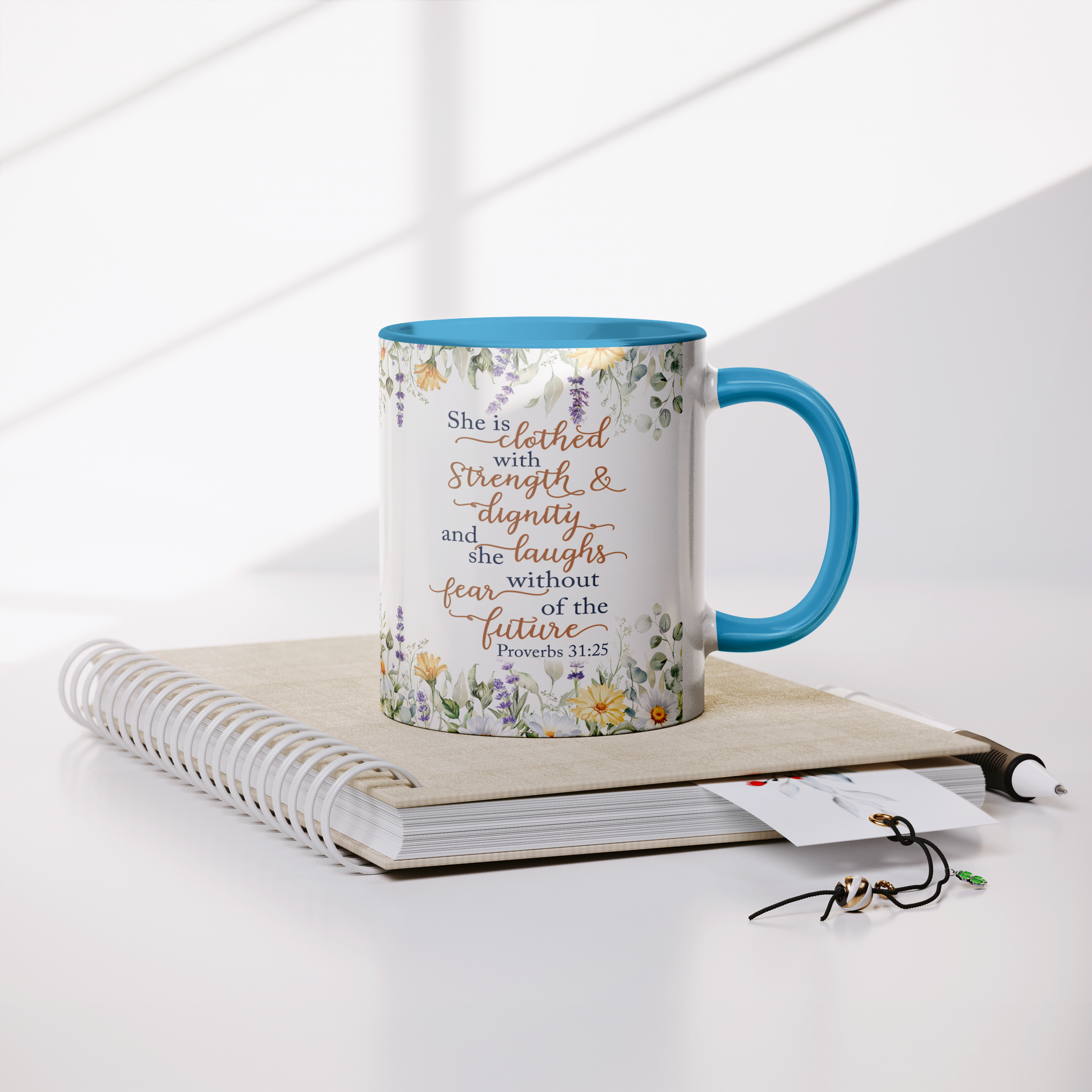 She_is_Clothed_in_Strength_and_Dignity_-_Lifestyle_Notebook_Mockup.png