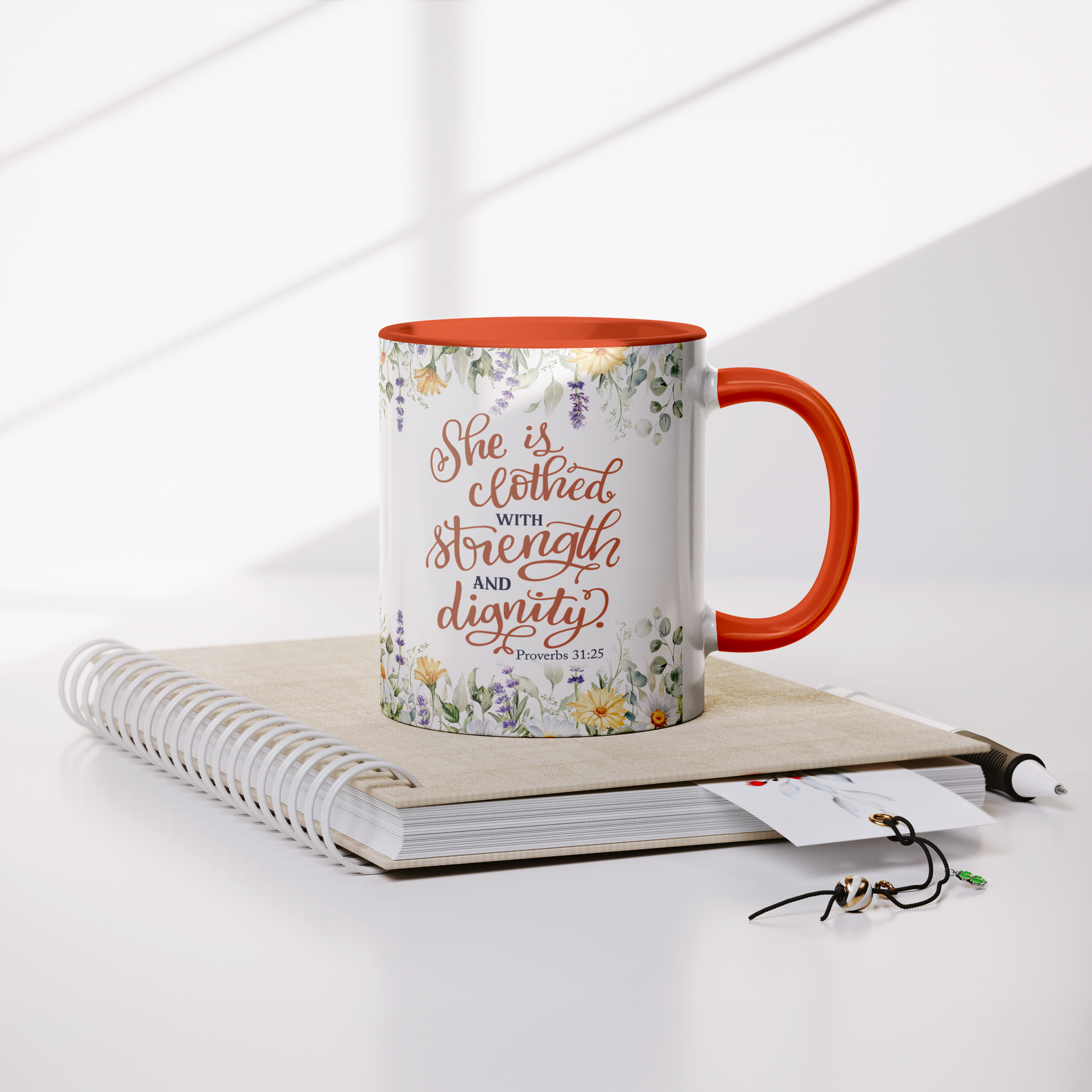 She_is_Clothed_in_Strength_and_Dignity_-_Lifestyle_Notebook_Mockup.png