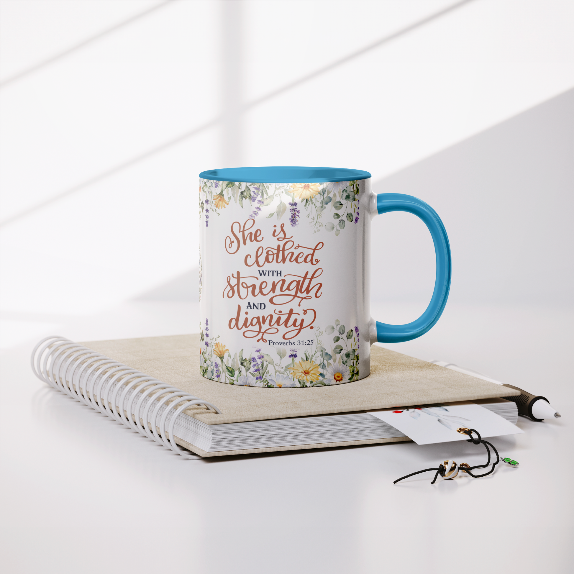 She_is_Clothed_in_Strength_and_Dignity_-_Lifestyle_Notebook_Mockup.png