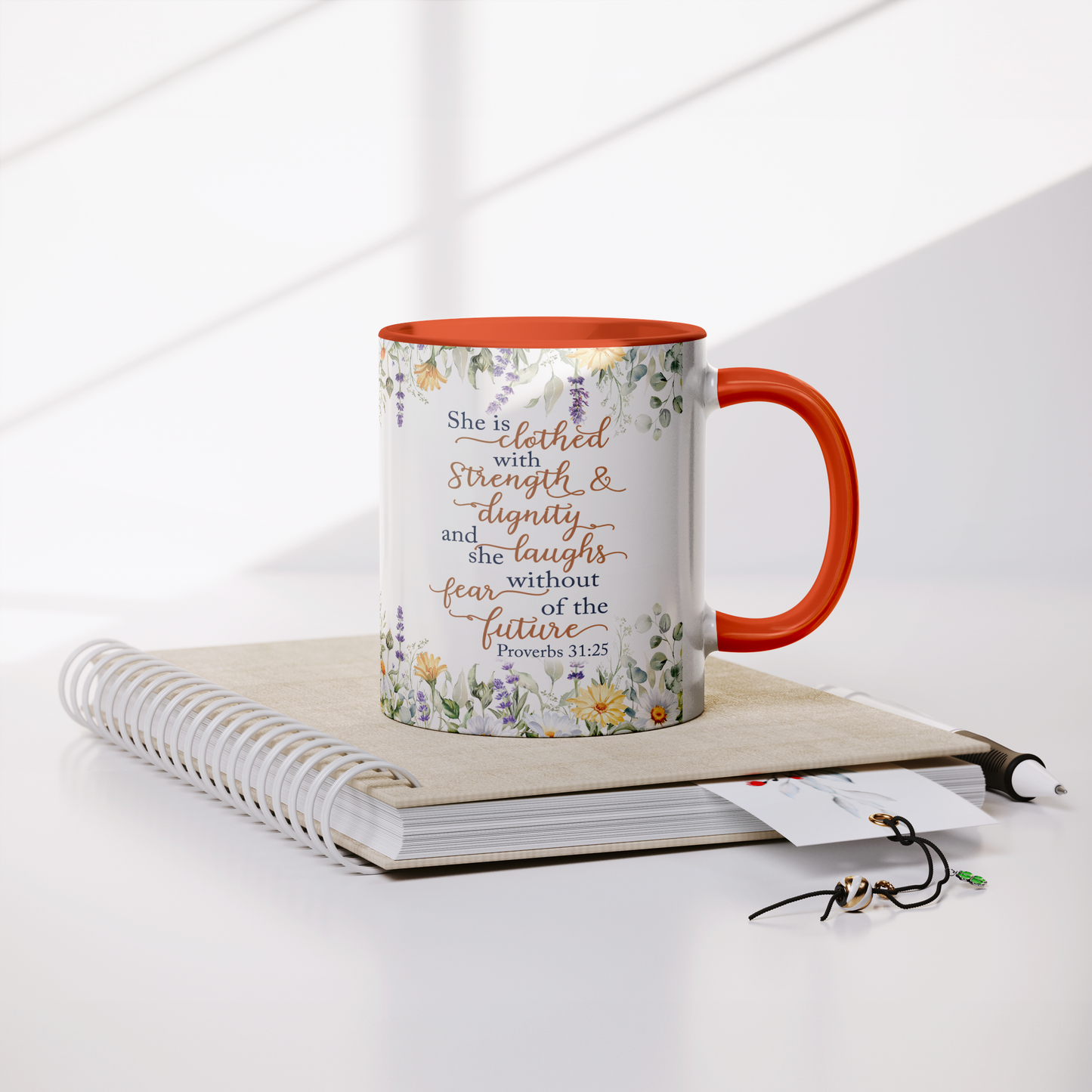 She_is_Clothed_in_Strength_and_Dignity_-_Lifestyle_Notebook_Mockup.png