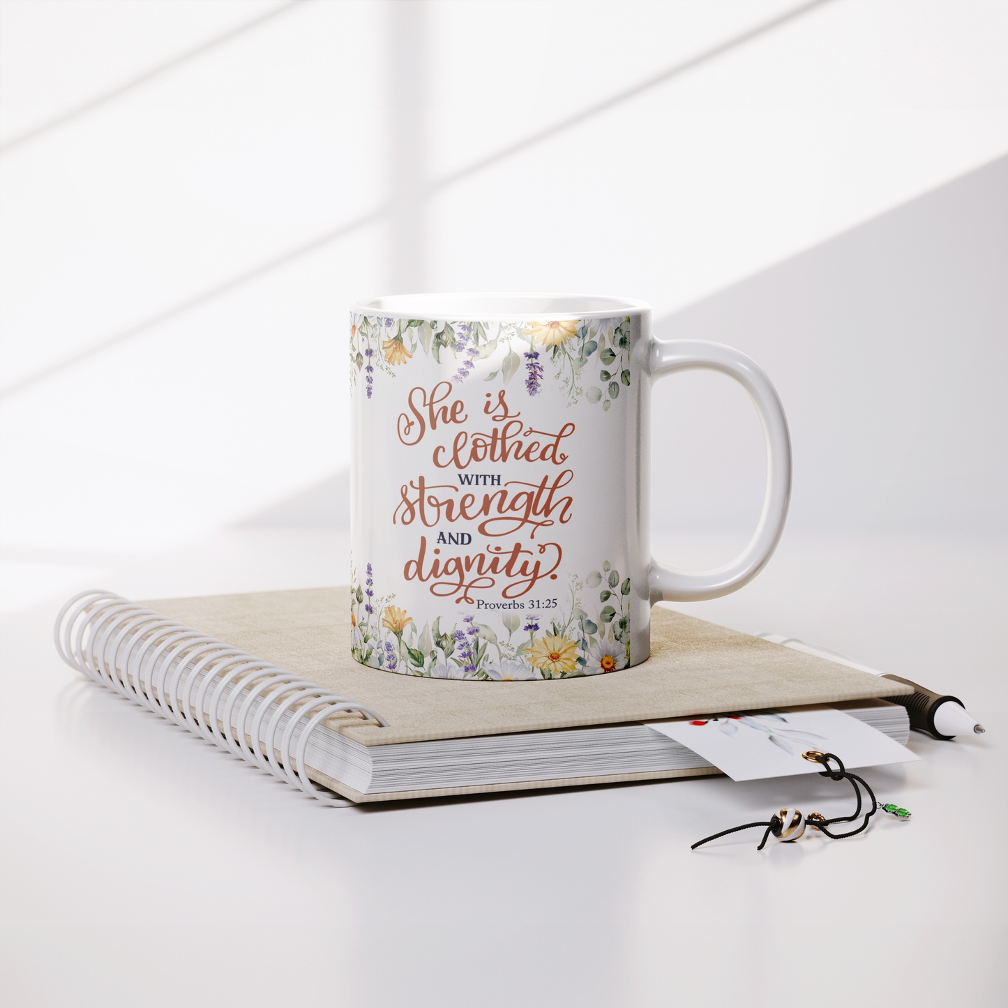 She_is_Clothed_in_Strength_and_Dignity_-_Lifestyle_Notebook_Mockup.png