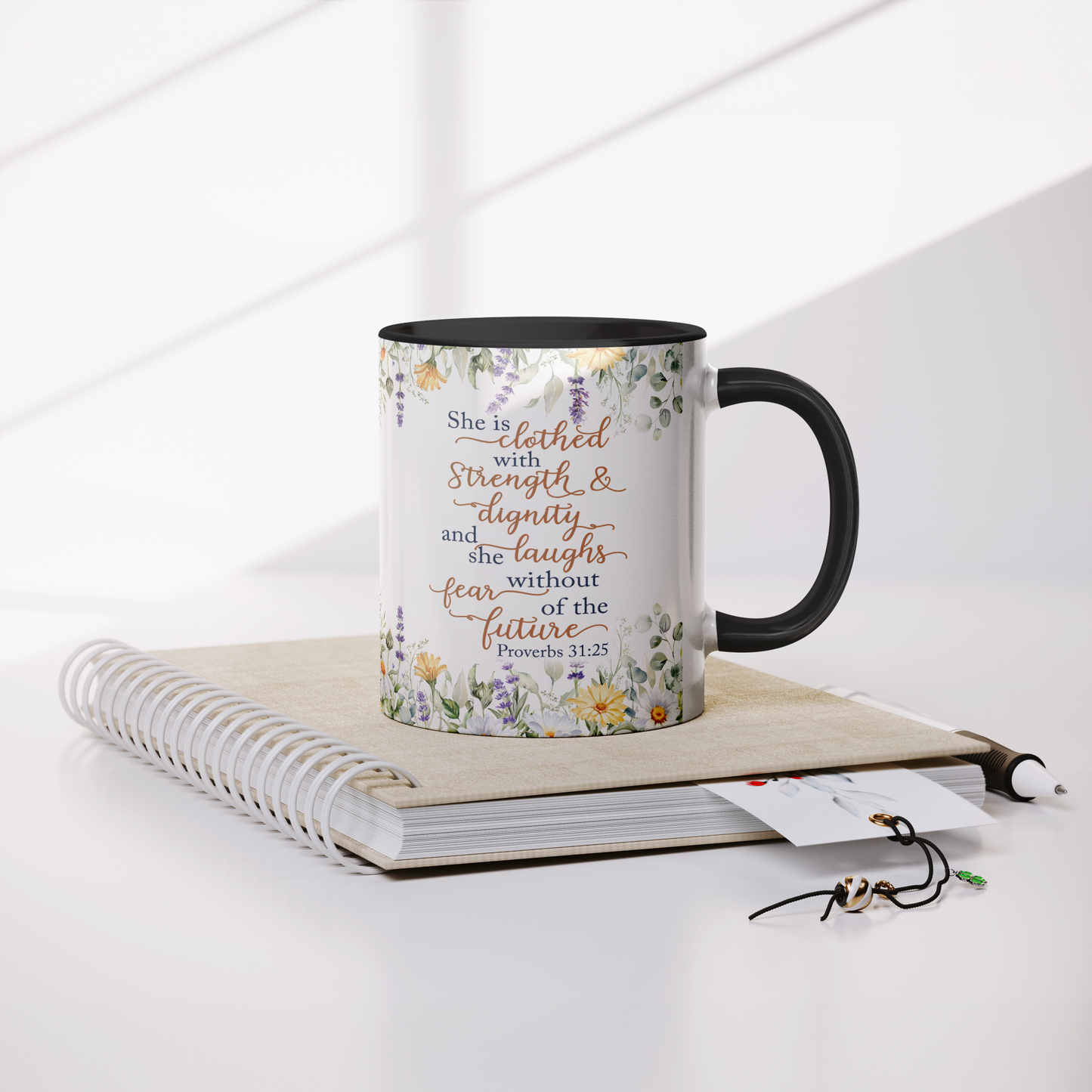 She_is_Clothed_in_Strength_and_Dignity_-_Mug_Lifestyle_Notebook_Mockup.png