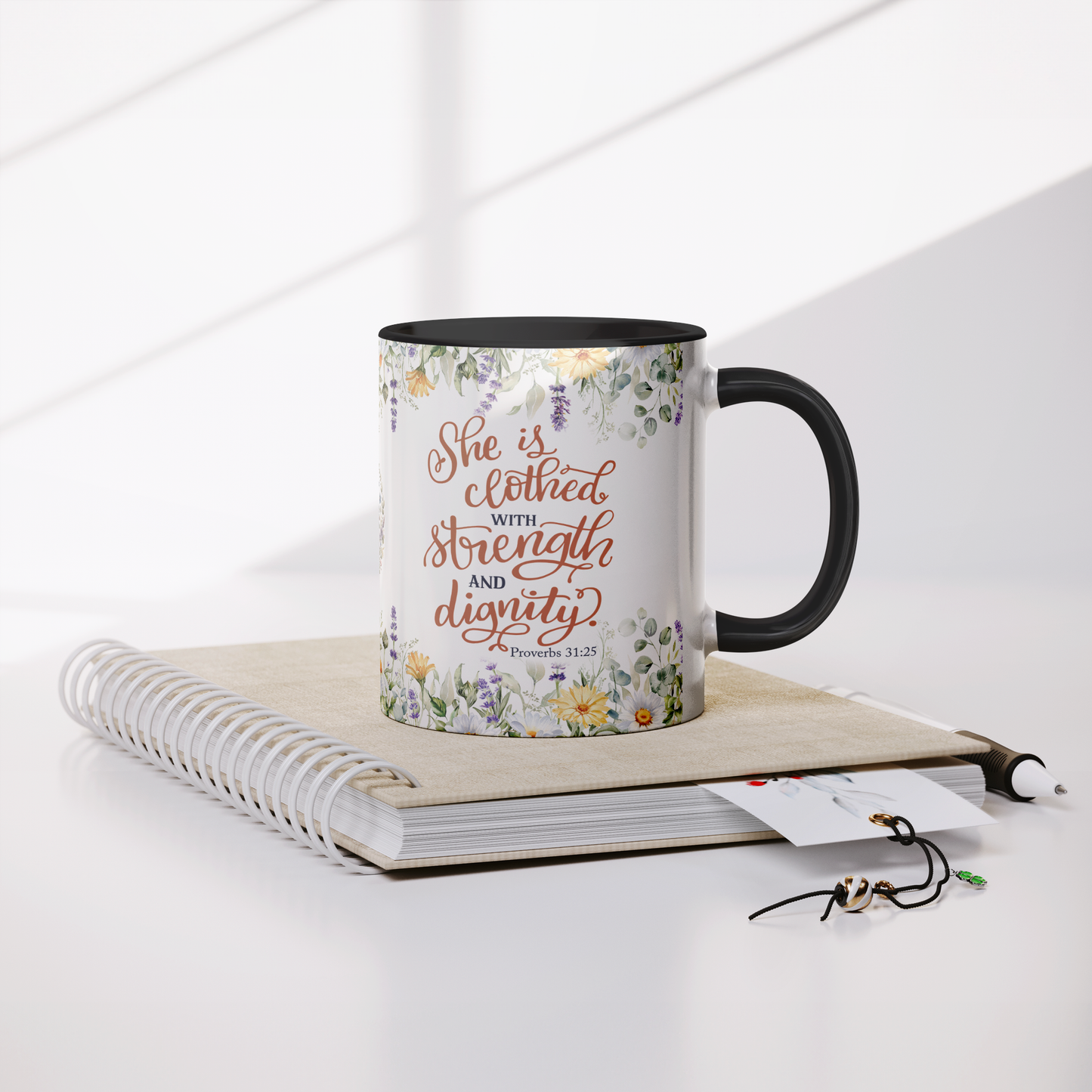 She_is_Clothed_in_Strength_and_Dignity_-_Mug_Lifestyle_Notebook_Mockup.png