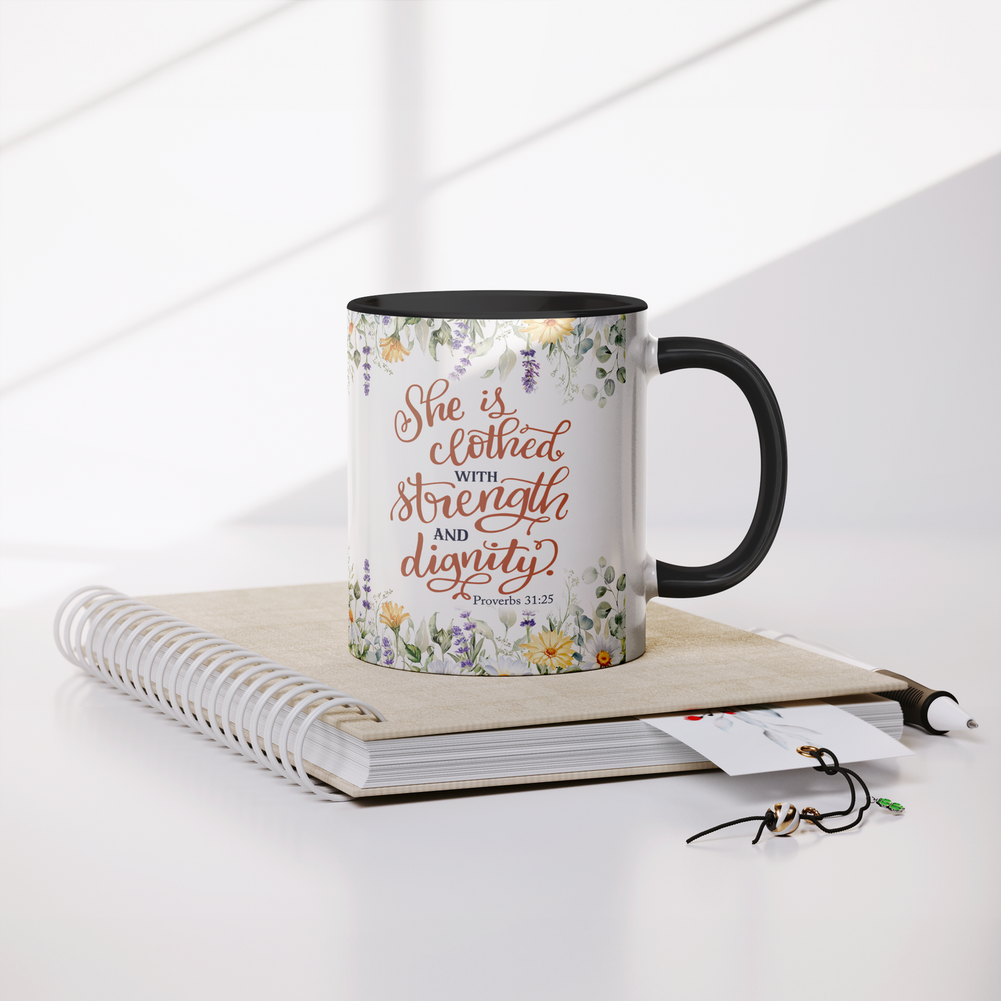 She_is_Clothed_in_Strength_and_Dignity_-_Mug_Lifestyle_Notebook_Mockup.png